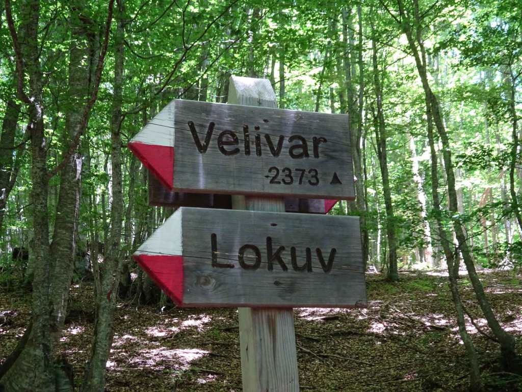 Signpost for Lake Lokuv and Velivar peak in Mavrovo National Park